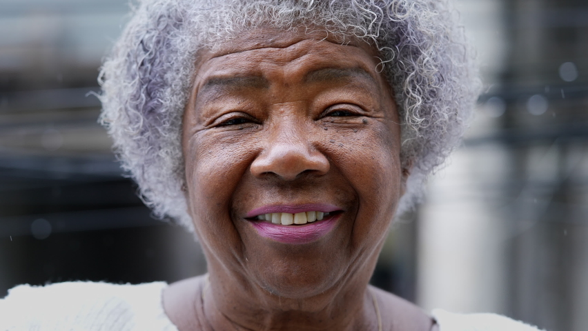 A joyful older black woman authentic smile real happy expression | Shutterstock HD Video #1086761111