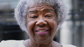 A joyful older black woman authentic smile real happy expression - Powered by Shutterstock - Get 15% off with code: PIKWIZARD15