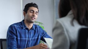 Happy confident indian recruit handshaking employer getting hired at new job. Smiling young male professional manager shake hand of famale client or customer making business deal at office meeting. - Powered by Shutterstock - Get 15% off with code: PIKWIZARD15