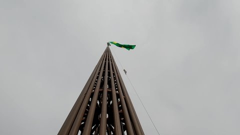 Brasilia, DF, Brazil, February 08, 2022: Flag of Brazil on its giant 100-meter-high flagpole at the plaza of Three Powers in Brasília in panoramic video