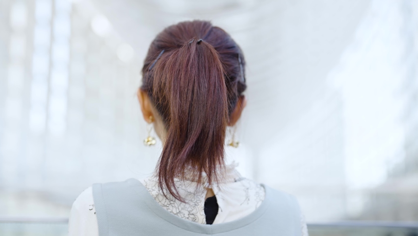 A young woman looking back with a smile