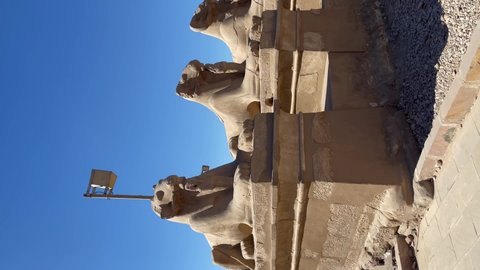 Alley of sphinxes with a ram's head at Karnak temple in Luxor. Luxor, Egypt - January 2022