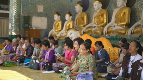 YANGON, MYANMAR - 2TH FEBRUARY, 2019: Tourists and local people in the Shwedagon Pagoda, Yangon, Myanmar, Asia