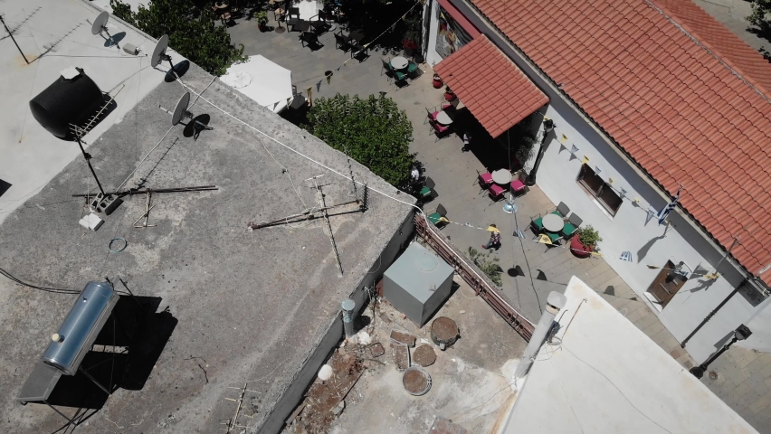 Beautiful rethymno cityscape with mountains on sunny day against clear sky