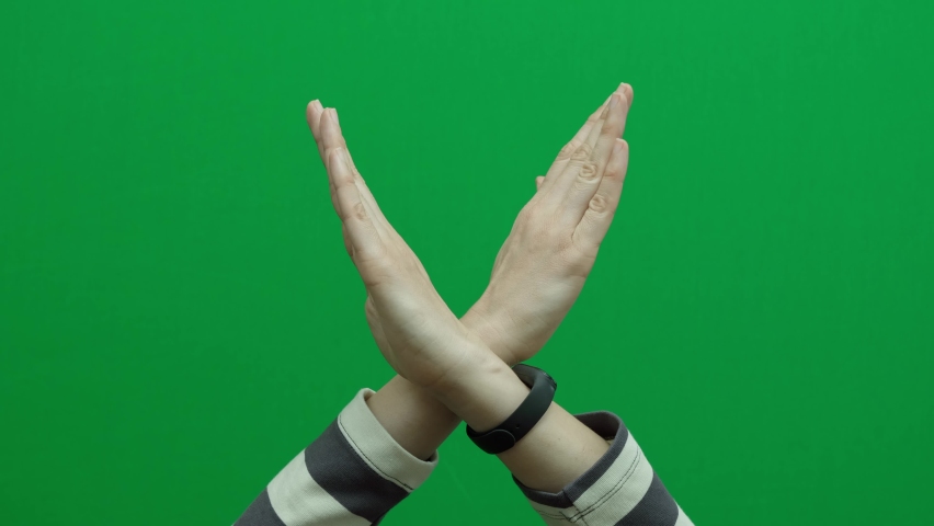Crossed hands. Break the bias symbol of woman's international day. Woman arms crossed to show solidarity, commitment to calling out bias, breaking stereotypes, inequality, rejecting discrimination | Shutterstock HD Video #1086777239