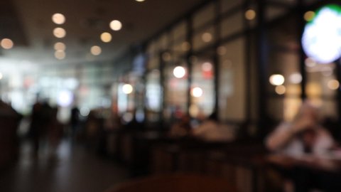 Blurred People in restaurant interior, blurred background.