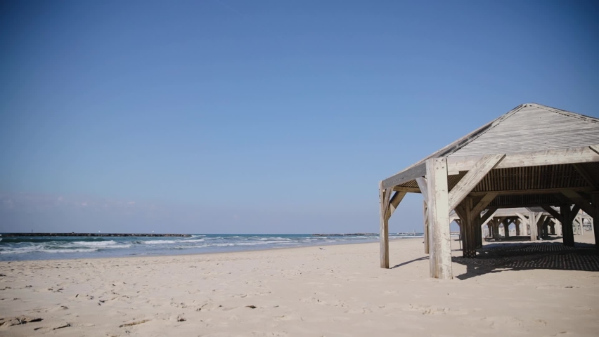 Empty beach of Tel Aviv in winter time. Coastline with no people at the Beach due to Government guidelines against virus of COVID-19