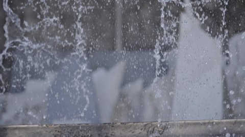 Splashing Water On Makrana Slab While On Cutting Process. Closeup
