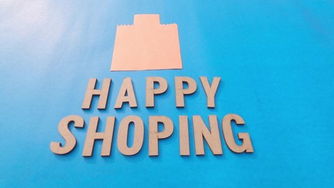 Hand Placing paper bag over Happy Shopping background. 