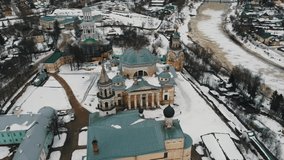 Aerial view of the Catholic Church in the city of Kursk. Roman temple among city houses. City landscape in Russia. Winter city.