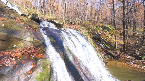Upper Shamokin Falls waterfall on hiking trail in autumn fall season brown landscape in Wintergreen Resort in Virginia Blue Ridge Mountains on sunny day side view