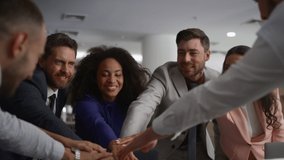 Multiracial employees celebrating successful corporate deal on conference meeting. Cheerful coworkers teambuilding bonding in financial office. Business team high five. Teamwork partnership concept. - Powered by Shutterstock - Get 15% off with code: PIKWIZARD15
