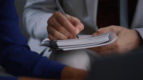 Businessman hand writing notebook working at corporate meeting office workplace. Unknown caucasian man holding pen on business conference close up. Young male lawyer filling report. Paper work concept - Powered by Shutterstock - Get 15% off with code: PIKWIZARD15