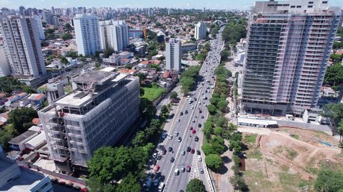 Aerial view of Sao Paulo city, in 23 de Maio avenue, north-south corridor. Prevervetion area with trees and green area of Ibirapuera park in Sao Paulo city, Brazil.