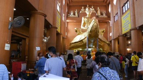Luang Pu Liu monk and buddha statue for thai people and foreign traveler travel visit respect praying at Wat Rai Tang Thong temple at Kamphaeng Saen city on January 27, 2022 in Nakhon Pathom, Thailand