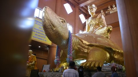 Luang Pu Liu monk and buddha statue for thai people and foreign traveler travel visit respect praying at Wat Rai Tang Thong temple at Kamphaeng Saen city on January 27, 2022 in Nakhon Pathom, Thailand