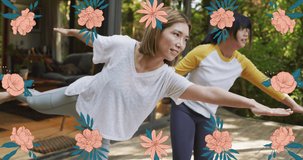 Animation of orange flowers over diverse women exercising yoga. health, exercise and leisure time concept digitally generated video.