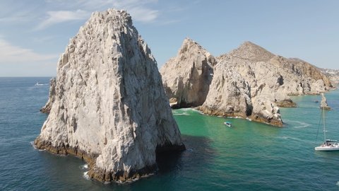 Aerial: boat tourism trip to El Arco of Cabo San Lucas, Mexico, Baja
