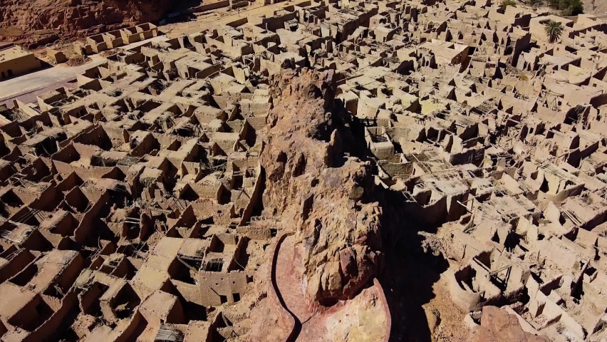 Aerial view over the Historical Castle, in the Al Ula old town, sunny Saudi Arabia - rotating, tilt, drone shot Royalty-Free Stock Footage #1086808928