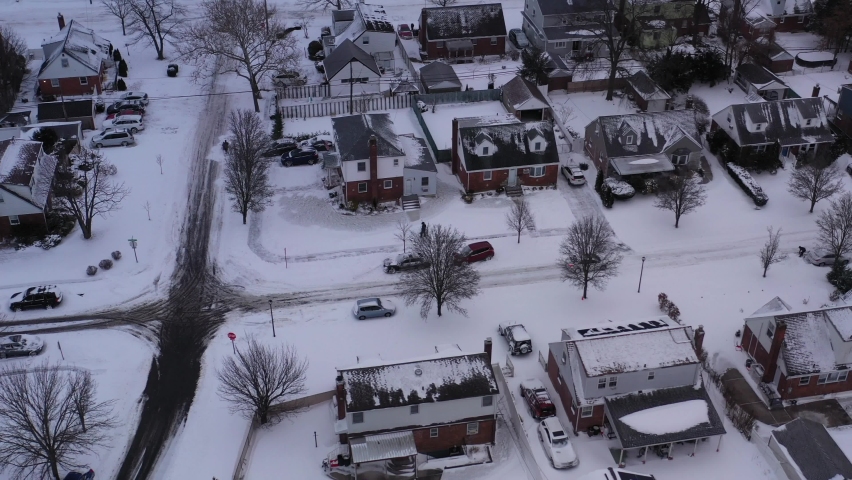 An aerial view of a suburban neighborhood after a nor