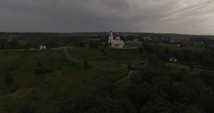 4K aerial video of lone cathedral on cloudy afternoon in Russia's Moscow forest region