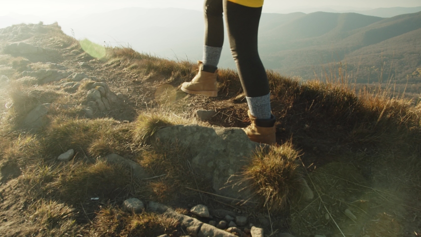 Feet Female Hiker Traveler Woman Walking And Climbing Up In Dangerous Rocky Top Mountain At Autumn Sunset. Nature, Travel Adventure Tourist Hiking. Legs In Trekking Boots. Foot Steps Of Climber Royalty-Free Stock Footage #1086815285