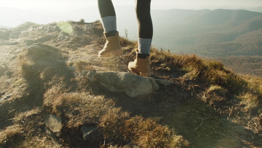 Feet Female Hiker Traveler Woman Walking And Climbing Up In Dangerous Rocky Top Mountain At Autumn Sunset. Nature, Travel Adventure Tourist Hiking. Legs In Trekking Boots. Foot Steps Of Climber | Shutterstock HD Video #1086815285