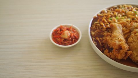 Korean instant noodles with fried chicken or Fried chicken ramyeon - Korean food style