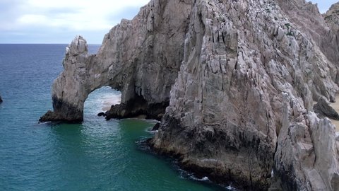 Drone shot Arch of Cabo San Lucas. Famous rock formation in Mexico