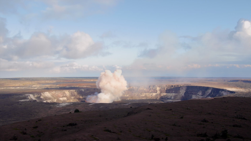 Kilauea volcano spewing up steam and smoke from a vent within the caldera