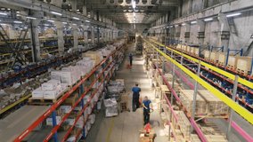 Workers in the warehouse. Workers with hydraulic forklifts in stock. Span over the rows of a warehouse on a drone - Powered by Shutterstock - Get 15% off with code: PIKWIZARD15