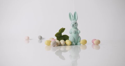 Bunnies toys on White Background, many coloured eggs. Happy Easter day. Banner and Place for Text message. Cute fluffy rabbit, Lovely Animal concept. Design Happy Easter Concept. Celebration Easter.