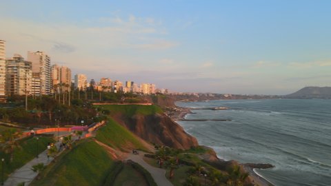 aerial view of the green coast and the sunset from the boardwalk of miraflores