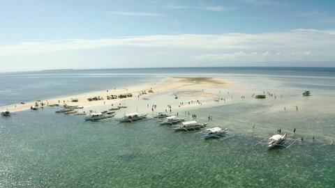 Aerial Of Sea Urchin Fishermen With Banca Boats Moored On Sandbank At Bohol. Parallax View