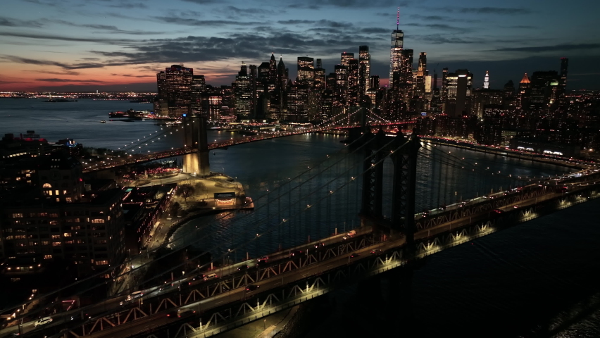dusk flying over Manhattan Bridge towards downtown NYC Royalty-Free Stock Footage #1086872429