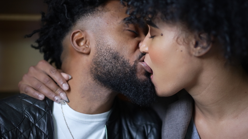 Passionate kiss a black couple kissing an African man and woman love Royalty-Free Stock Footage #1086875174