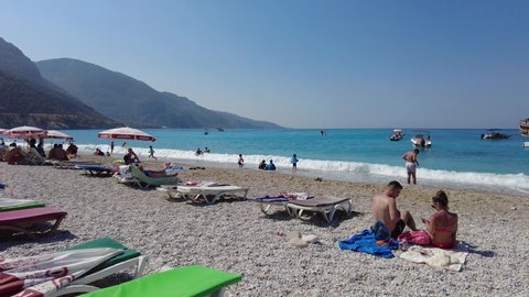 Oludeniz beach blue lagoon with vacationing. Oludeniz Turkey August 2021