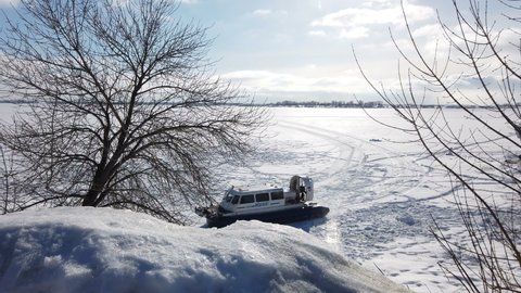 hovercraft rides on the frozen lake. High quality 4k footage