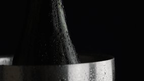 4k video of water droplets running down a chilled wine bottle and bucket. High quality water particles sliding down wine chiller for events and parties. - Powered by Shutterstock - Get 15% off with code: PIKWIZARD15