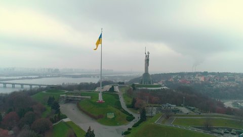 Aerial drone footage. Fly to Motherland Monument Flagpole with the Flag of Ukraine in Kyiv. Ukraine, Kyiv 2020
