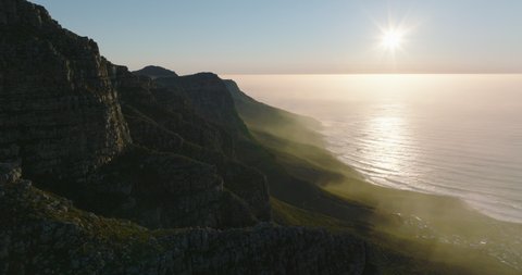 Beautiful shot of mountain landscape along sea coast. Forwards fly above Table Mountain National Park. Cape Town, South Africa