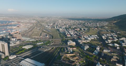 Various modes of transportation in city. Aerial view of transport infrastructure. Seaport, train station and highways. Cape Town, South Africa