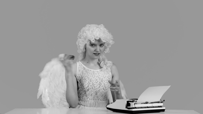 Beautiful woman writes letter to Angel. Black and white. Valentines day.