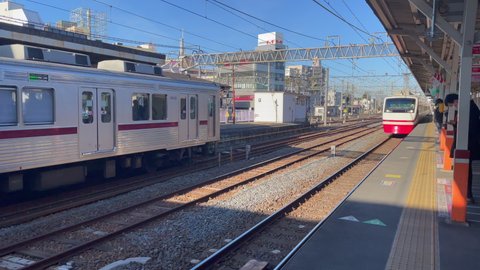 Kasukabe, Saitama, Japan. February 9, 2022. The Limited Express Ryomo train going through Kasukabe Station,  on its return journey from Nikko, Tochigi to Asakusa Station, Tokyo on a sunny morning. 