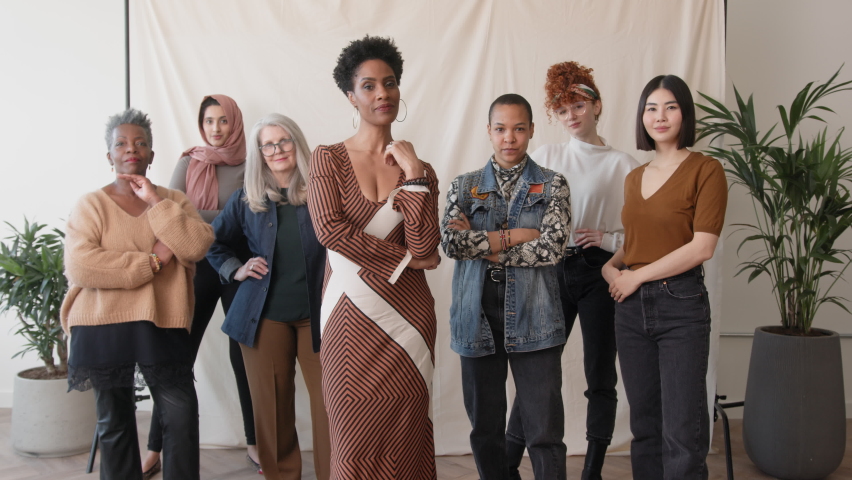 Slow motion of multi ethnic mixed age range women celebrating International Women's Day and smiling towards camera | Shutterstock HD Video #1086912092