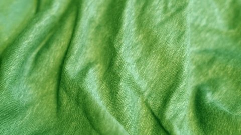 Green Woolen Smooth Fine Knit Fabric, Wool Textile, Clothing, Jacket, Bedspread, Plaid. Woolen Production, Textile Factory. Green Abstract Background.