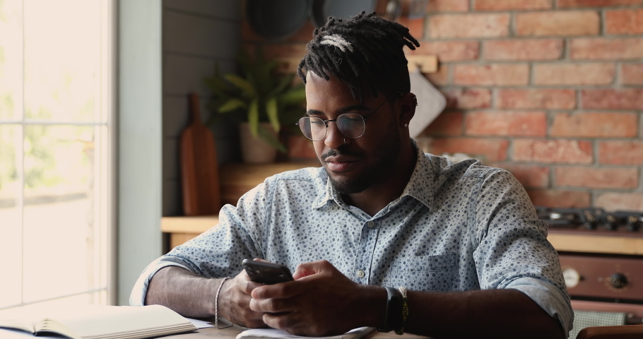 Overjoyed euphoric Black guy hipster scream super wow yes read unbelievable sale offer on cell get unexpected praise feedback great reward for job. Lucky excited young man enjoy winning online lottery Royalty-Free Stock Footage #1086926897