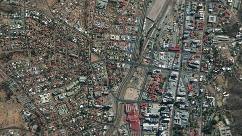 Earth zoom in from space and focus on Namibia, Windhoek. The animation continues by zoom out through clouds and atmosphere into space. Background for travel intro.