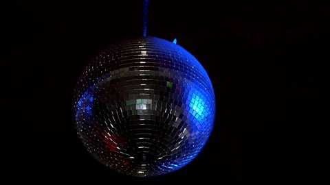 Rotating sparkling mirror disco ball. Concept of night party.	