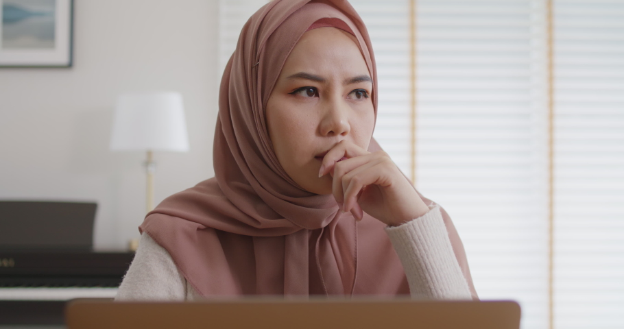 Asia people young adult west arab woman wear hijab scarf worry tired upset in cash flow bad news SME debt crisis impact loan money loss. Job issue work at home feel pain stress think hard tough. Royalty-Free Stock Footage #1086941390